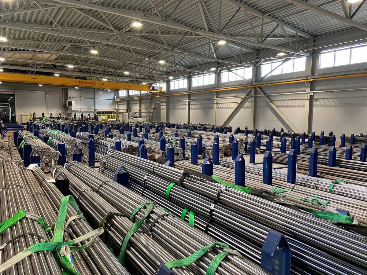 Heavy-duty wire sits in a factory ready to be coiled into springs.
