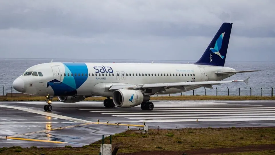 Commercial passenger aircraft taxiing on runway, representing aerospace and aviation industry.