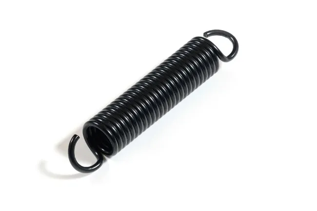 A black coated extension spring with open hook ends at both ends, lying diagonally on a white background.