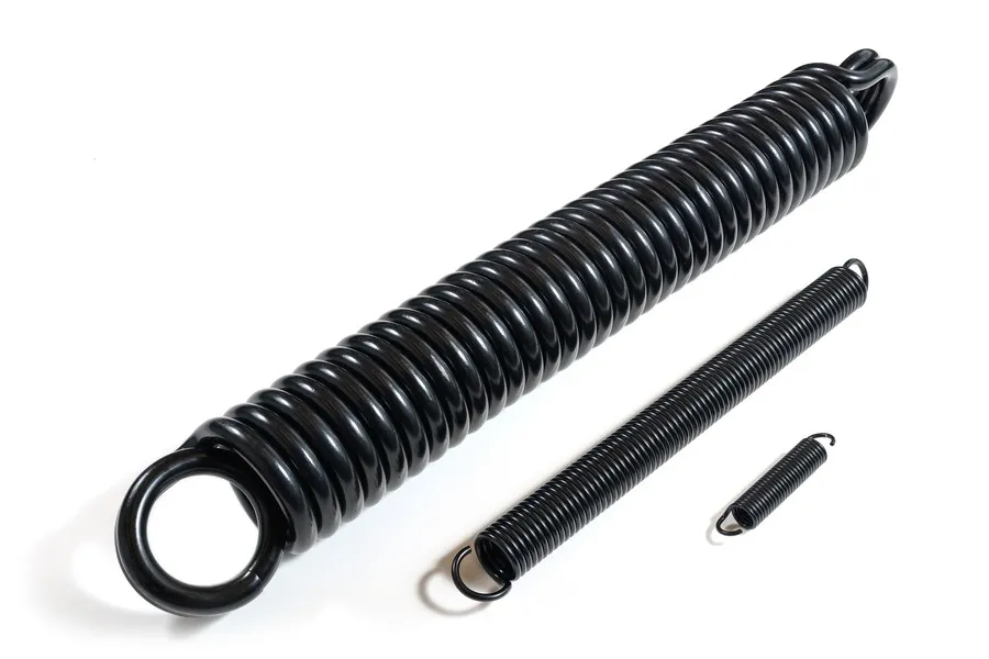 Three custom extension springs, one large, one medium and one small, with varying hook ends.