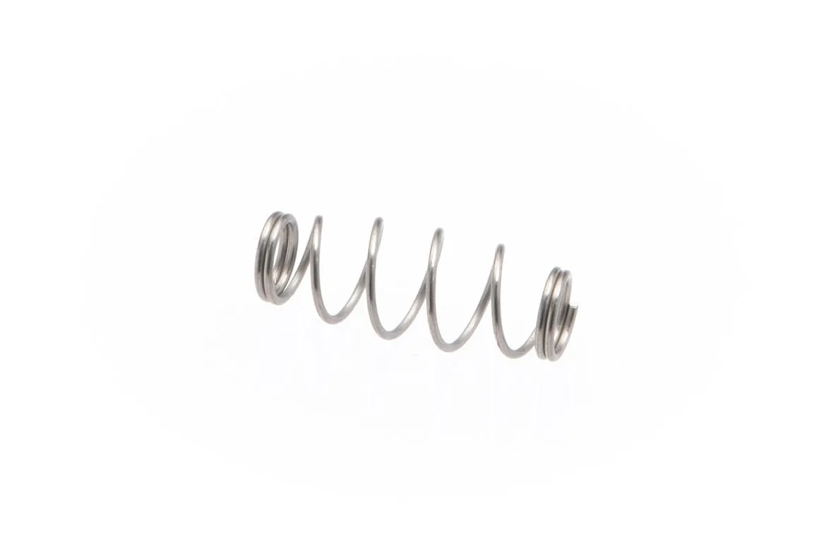 compression spring with open-coil winding and closed ends, photographed on a white background.