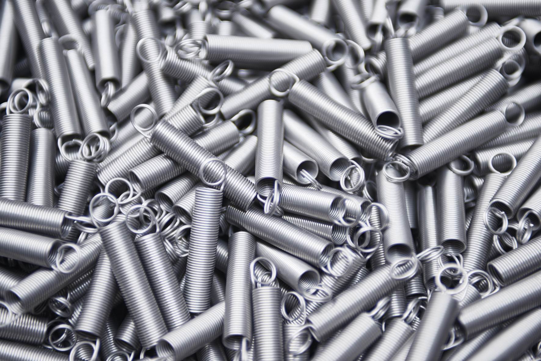 Loose tension springs used in industrial manufacturing applications.