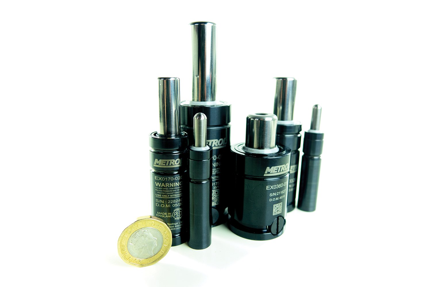 A collection of nitro springs of varying sizes, set against a white background. 
